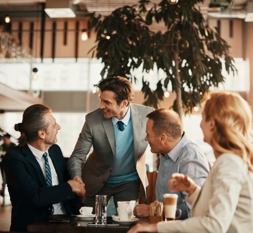 Group,Of,Middle,Aged,Business,Coworkers,Having,A,Meeting,Over